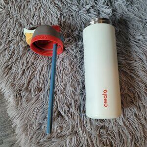 Beige and multi-colored Owala 24oz water bottle - has damage in pictures